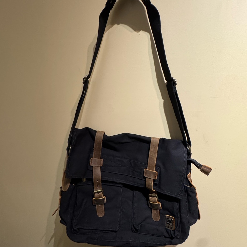 S.C. Cotton black canvas messenger bag with brown leather accents. EUC